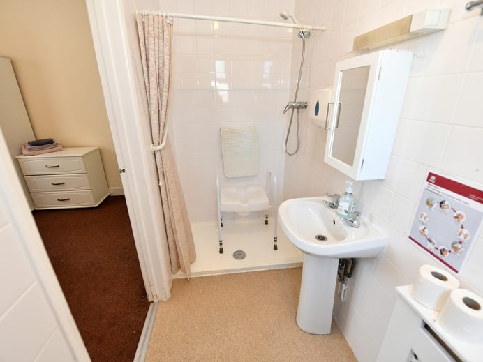 Accessible shower room with shower chair